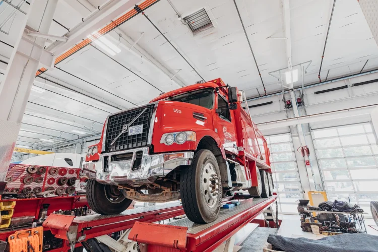 Semi Truck Services That Pay for Themselves (And the Ones That Don't) 3 Semi truck receiving professional maintenance service in equipped repair facility